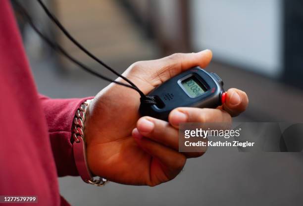 fitness instructor using stopwatch, close-up of hand - stop watch stock pictures, royalty-free photos & images
