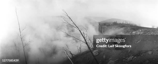 View of smoke and toxic fumes from an underground coal seam fire, Centralia, Pennsylvania, July 19, 1982. The town was largely abandoned due to the...