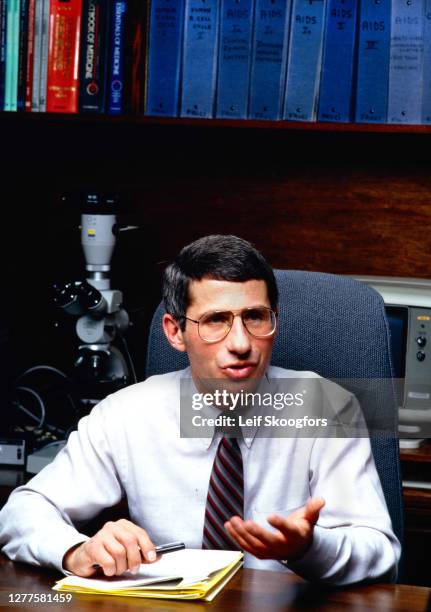 View of American physician, immunologist, and Director of the National Institute of Allergy and Infectious Diseases Dr Anthony Fauci as he sits...