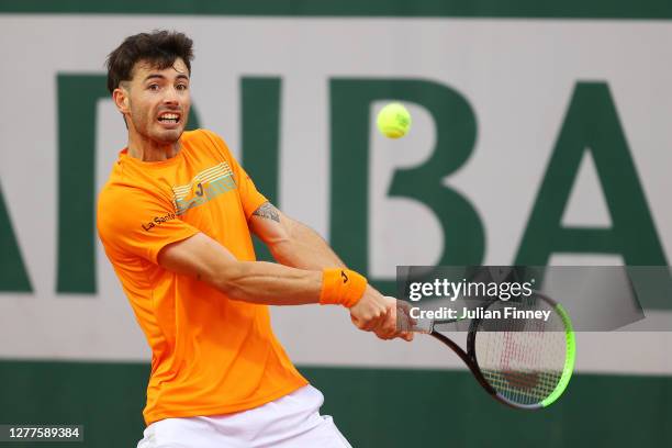 Juan Ignacio Londero of Argentina plays a backhand during his Men's Singles second round match against Marco Cecchinato of Italy on day four of the...