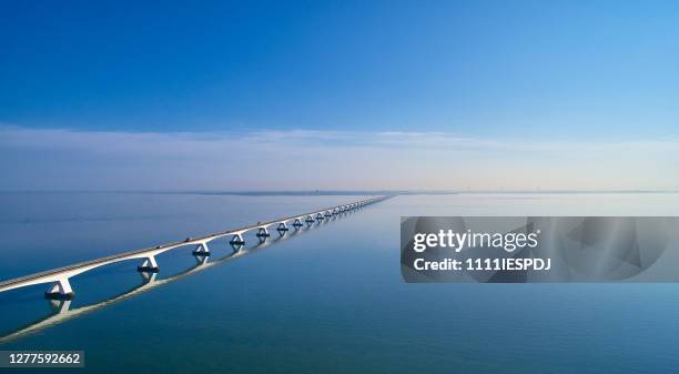 zeeland bridge aerial - zeeland netherlands stock pictures, royalty-free photos & images