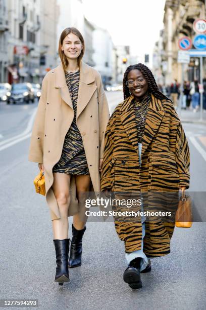 Influencer Jacqueline Zelwis, wearing a beige coat by Lala Berlin, an animal printed dress by Lala Berlin, black boots by Fendi and a dark yellow bag...