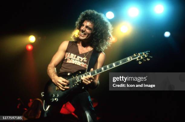 American rock guitarist, songwriter, vocalist and founding member of the American rock band Journey, Neal Schon performs performs during the band's...