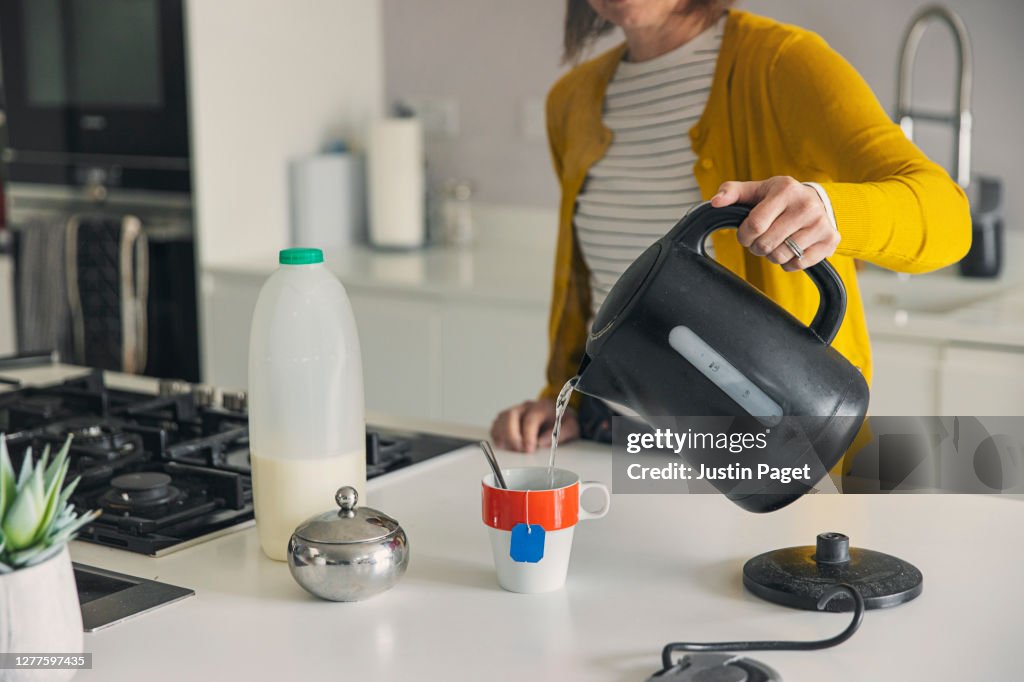 Woman making a cup of tea