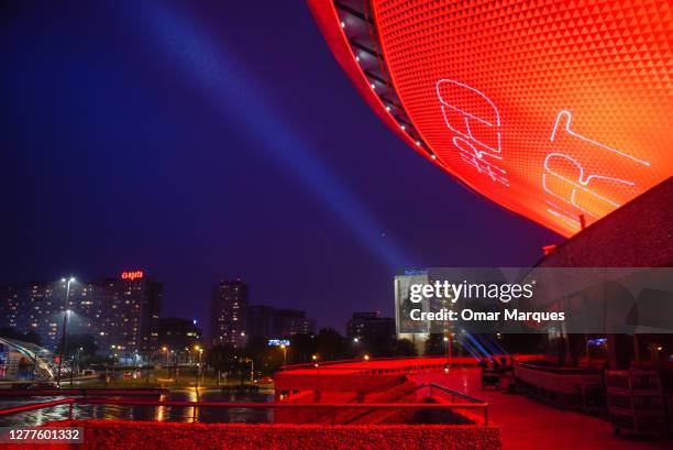 An aerial view of the iconic communist-era arena complex named Spodek lit up in red lights during a global action to raise awareness of the live...