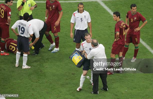 World Cup Football Quarter Final. England v Portugal."nCristiano Ronaldo of Portugal watches as sent off Wayne Rooney of England collides with the...
