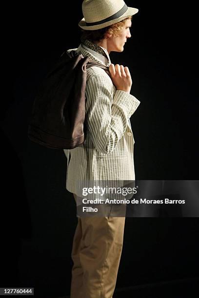 Model walks the runway during the Agnes B Menswear Spring/Summer 2012 show as part of Paris Fashion Week on June 26, 2011 in Paris, France.