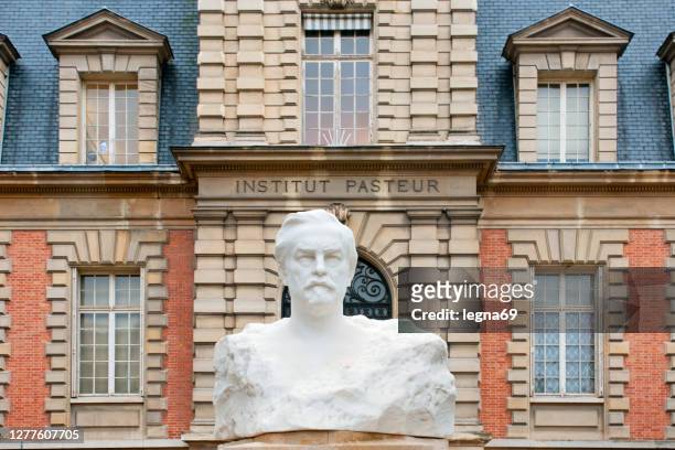 pasteur bust in front of the  pasteur institute in paris. - louis pasteur stock pictures, royalty-free photos & images