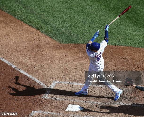 Ian Happ of the Chicago Cubs hits a solo home run in the 5th inning against the Miami Marlins during Game One of the National League Wild Card Series...