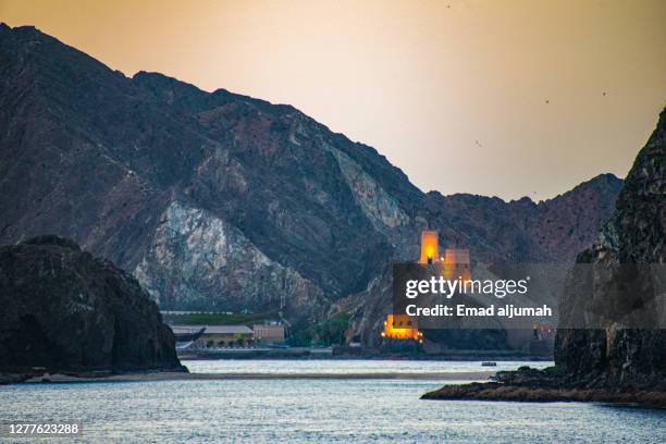 sunset dhow cruise along oman's spectacular coast, muscat, oman - oman muscat stock pictures, royalty-free photos & images