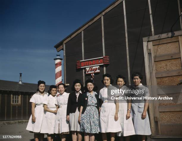 Eight Women standing in front of Camp Barber Shop, Japanese-American Camp, War Emergency Evacuation, Tule Lake Relocation Center, Newell, California,...