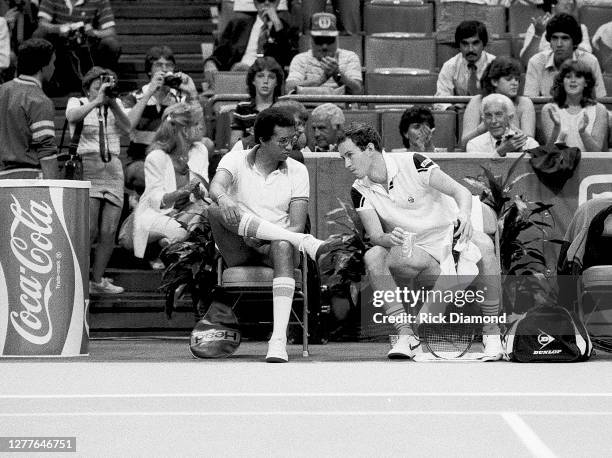 Davis Cup Manager Arthur Ashe and player John McEnroe attend Davis Cup at The OMNI Coliseum in Atlanta Georgia, July 14,1984 (Photo by Rick...