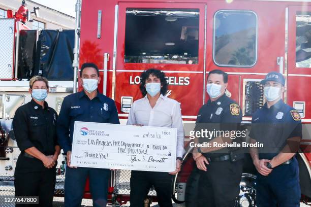 Firefighter Kimberly Rudloff; firefighter Michael Marquez; Chief Operating Officer of GetaTaxLawyer.com Tyler Bennett, JD, EA; firefighter Robert...
