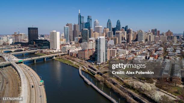 panoramic aerial view on philadelphia downtown over schuylkill river in a sunny day. - philadelphia skyline stock pictures, royalty-free photos & images