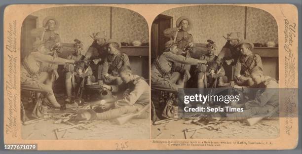 Staged show of six men eating and drinking in a destroyed house in South Africa, Remington Scouts enjoying lunch in a Farmer's home - wrecked by...