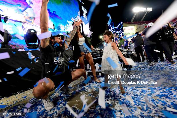 Zach Bogosian of the Tampa Bay Lightning throws confetti with his daughter during the 2020 Stanley Cup Champion rally on September 30, 2020 in Tampa,...