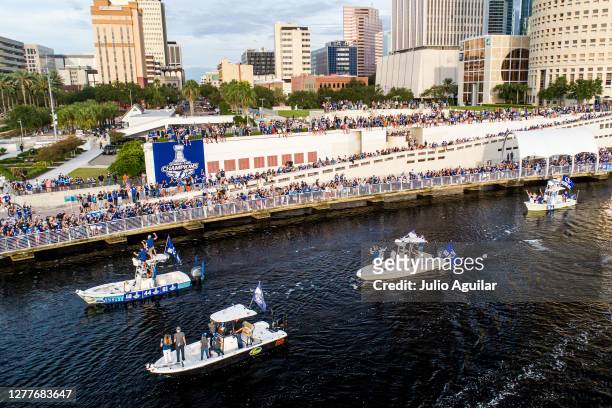 Ondrej Palat, Jan Rutta, and Erik Cernak of the Tampa Bay Lightning celebrate with fans from a boat at the Tampa Bay Lightning Victory Rally & Boat...