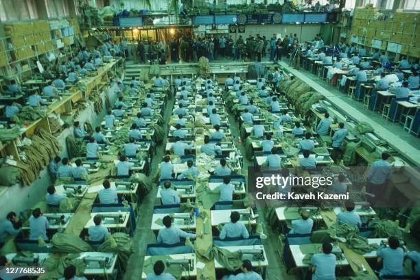 Political prisoners making clothing for the Iran-Iraq War effort in a workshop at Evin Prison in Tehran, Iran, 10th February 1986.