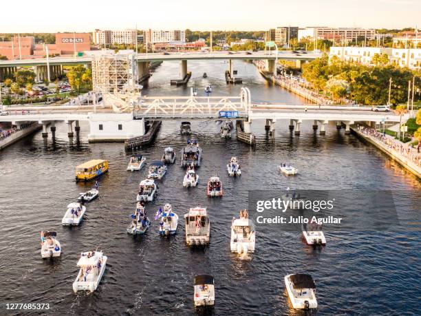 The Stanley cup makes its way under a bridge with Steven Stamkos, Victor Hedman, and Luke Schenn at the Tampa Bay Lightning Victory Rally & Boat...