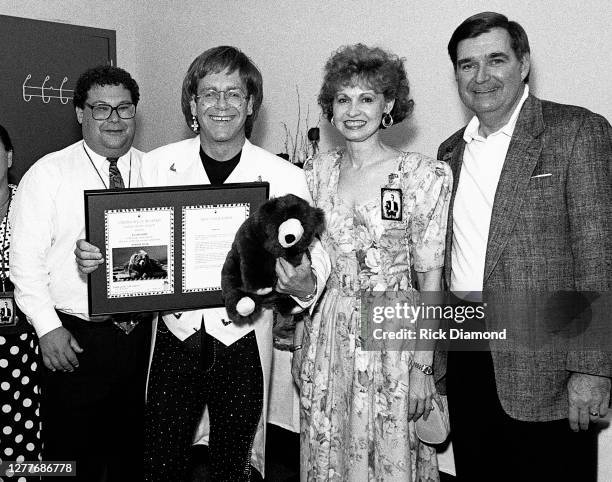 Steve Koonin Turner Broadcast, Elton John, Kay Ivester and Douglas Ivester Chairman/CEO Coca-Cola Company backstage at Lakewood Amphitheater in...