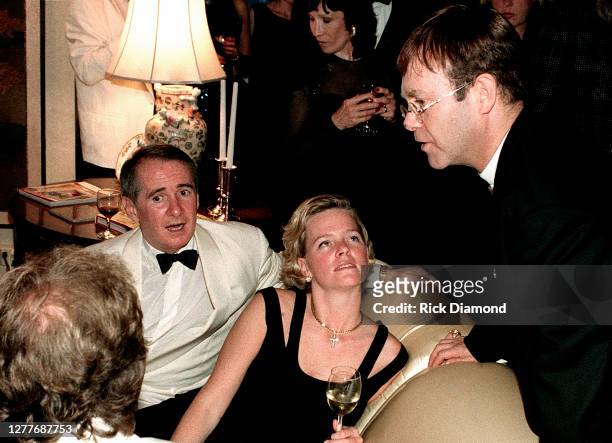 Former manager John Reid, Guest and Elton John attend Elton John Aids Foundation charity hosted by his neighbors at Elton's Atlanta home Park Place...