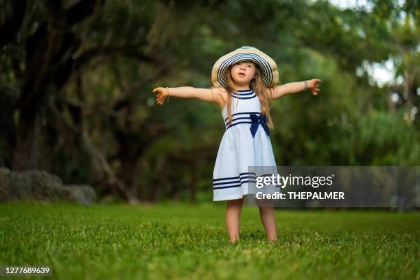 girl having fun in the park with open arms - open day 4 stock pictures, royalty-free photos & images