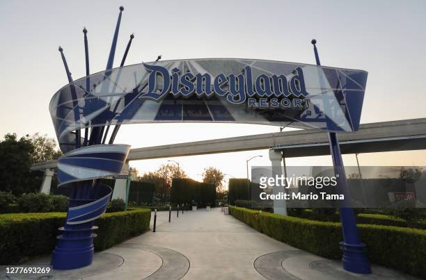 Disneyland sign is posted at an empty entrance to Disneyland on September 30, 2020 in Anaheim, California. Disney is laying off 28,000 workers amid...