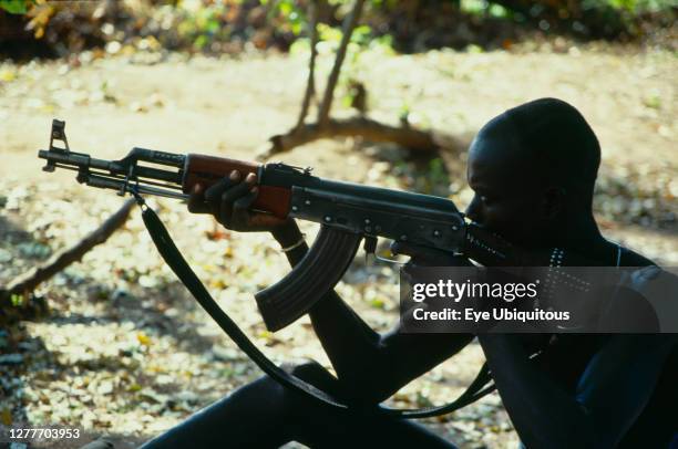 Ethiopia, General, Mursi tribesman with kalashnikov.