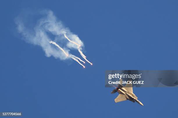 Israel's F-15E Strike Eagle fighter plane releases flares during the graduation ceremony of Israeli Air Force pilots at the Hatzerim base in the...