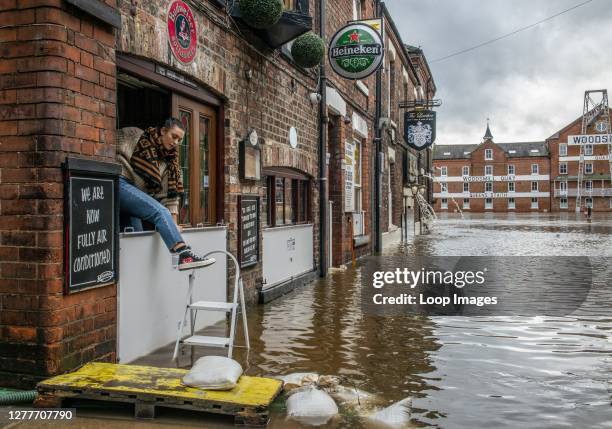 Heavy floods in York city centre where brave residents try to get on with their lives.