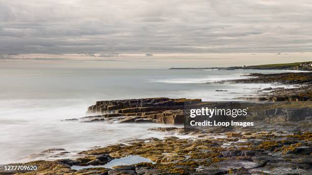 The rocky Northumberland coast just after dawn.