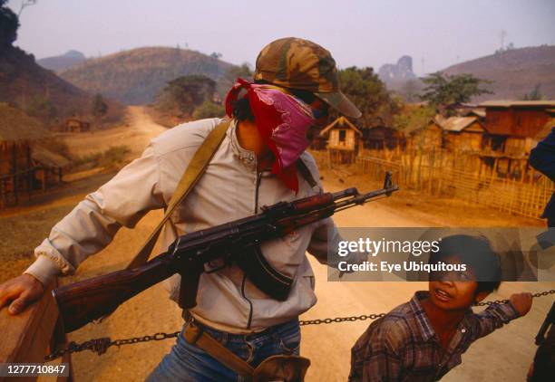 Laos, Armed guard on upcountry truck.