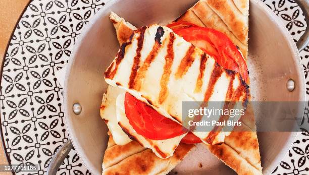 grilled halloumi cheese, in crete restaurant, greece - halloumi cheese stock-fotos und bilder