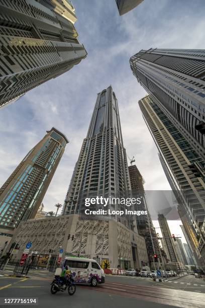 Some of the world's tallest residential buildings tower over traffic underneath in the Dubai Marina.