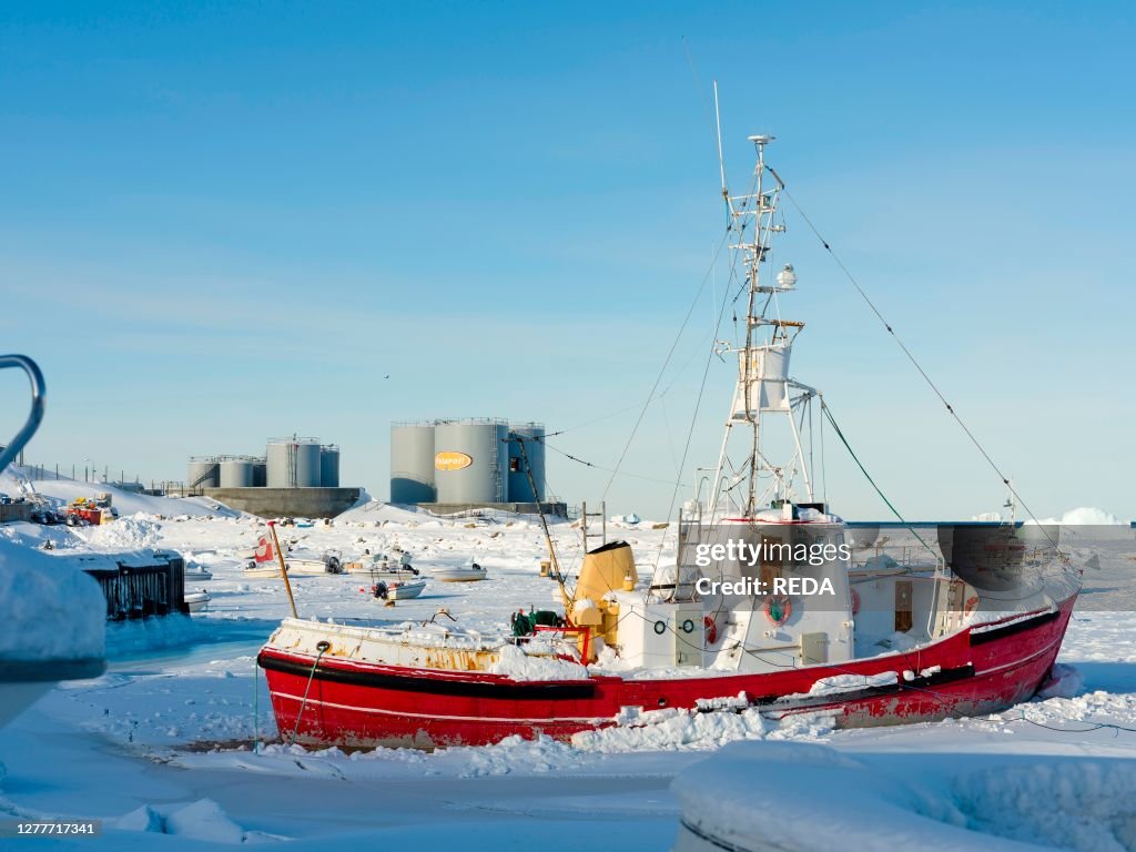 Frozen harbour. Winter in the town of Upernavik in the north of Greenland at the shore of Baffin Bay. America , Denmark, Greenland
