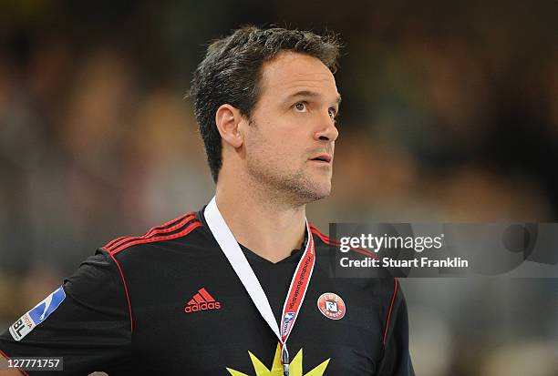 Markus Baur, head coach of Luebbecke ponders during the Toyota Handball Bundesliga match between TuS N-Luebbecke and Eintracht Hildesheim on October...