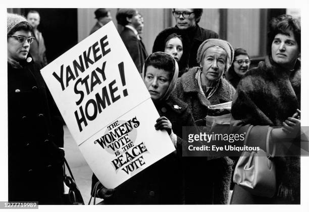 New York State, New York City, Anti Vietnam war demonstrators, group of women with one holding placard with Yankee Stay Home.