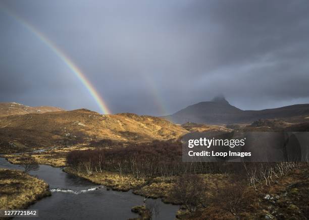 Rainbow appears over the River Polly after a storm front passes through.