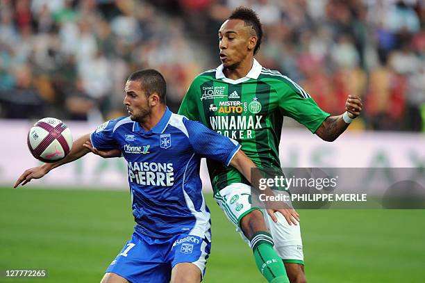 Auxerre's Israelian forward Ben Sahar vies with Saint-Etienne's French forward Pierre Emerick Aubameyang during the French L1 football match...