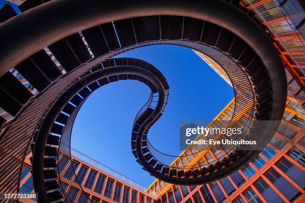 Germany, Bavaria, Munich, Angular view from below of a section of The Endless or Infinite Staircase sculpture by Olafur Eliasson with KPMG offices...