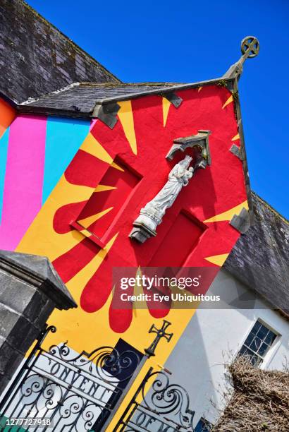 Ireland, County Mayo, Westport, Colourful mural by the artist Maser on the walls of the former Convent of Mercy school building.