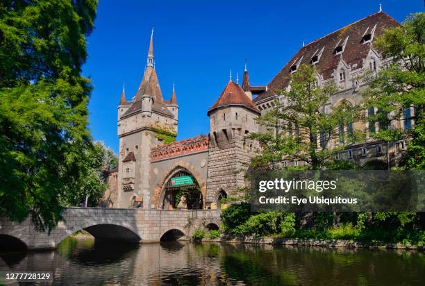 Hungary, Budapest, Vajdahunyad Castle, entrance gate to the castle over a small stream.