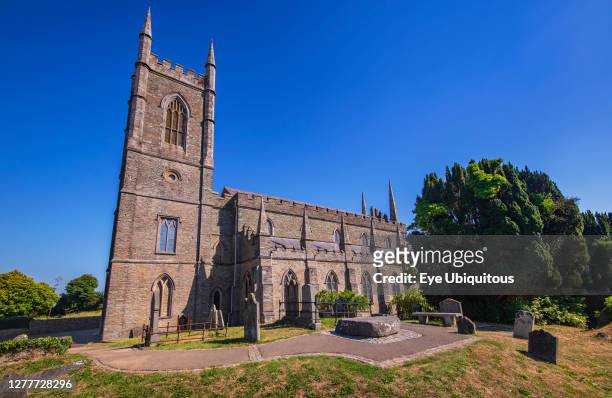 Ireland, County Down, Downpatrick, Cathedral Church of the Holy Trinity also known as Down Cathedral with Mourne granite slab marking the traditional...