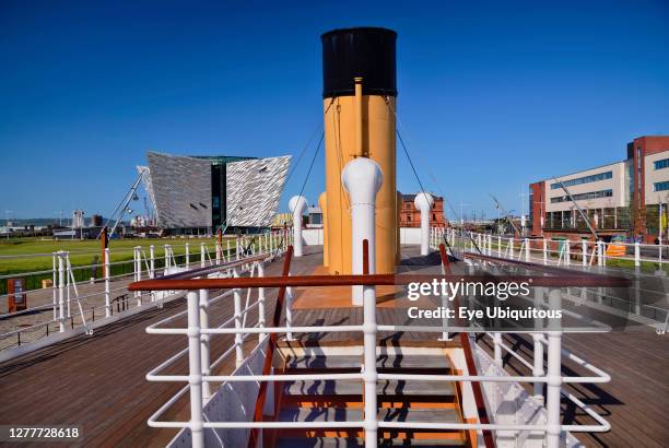 Ireland, County Antrim, Belfast, Titanic Quarter, Titanic Belfast visitor attraction seen from the upper deck of the restored SS Nomadic a former...