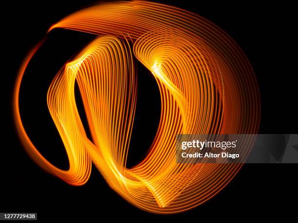 modern orange lines that form a face. - light painting stock-fotos und bilder