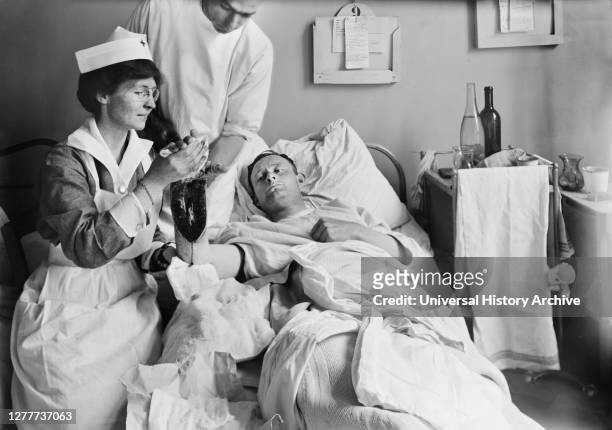 Nurse Dressing Wound of Injured American Soldier at Military Hospital I, Neuilly, France, Lewis Wickes Hine, American National Red Cross Photograph...