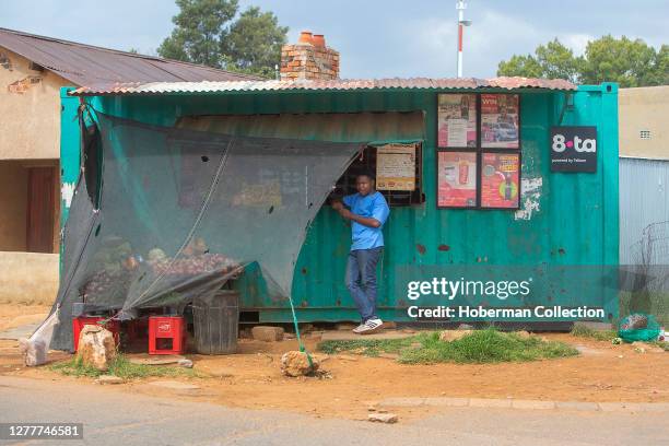 African male adult at 'spaza' shop in Soweto township, South Africa