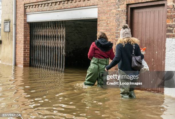 Heavy floods in York city centre where brave residents try to get on with their lives.