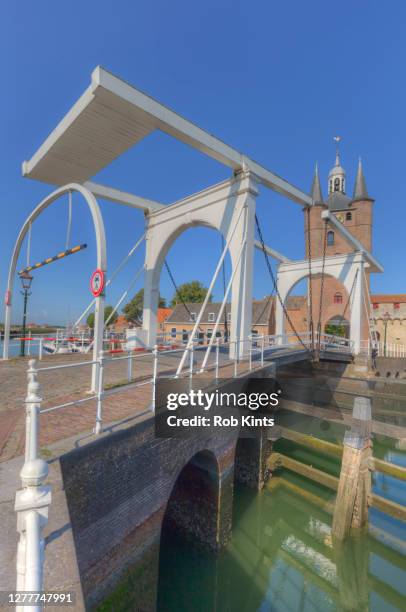 drawbridge and city gate ( zuidhavenpoort ) of  the old port of zierikzee, the netherlands - zeeland netherlands stock pictures, royalty-free photos & images