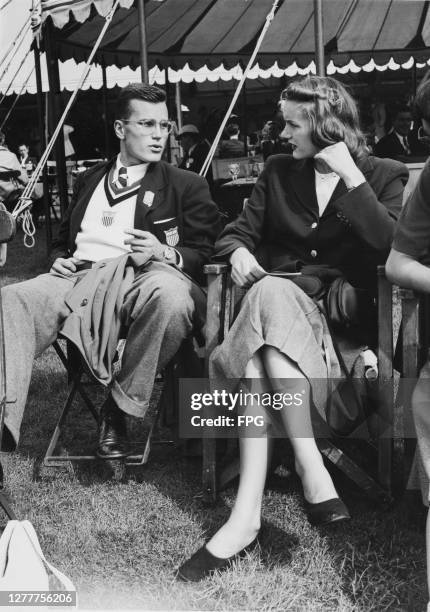 Two members of the US Olympic team chatting at Henley-on-Thames in England during the rowing event in the 1948 Summer Olympics, the XIVth Olympiad,...